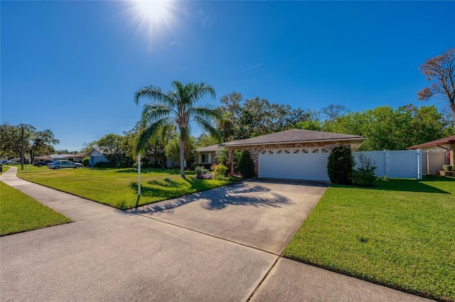 single story home featuring a front yard and a garage