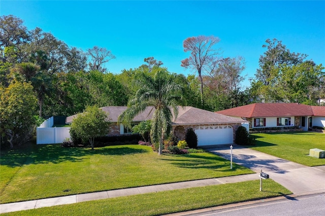 single story home featuring a garage and a front yard