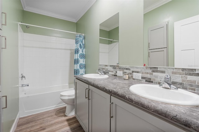 full bathroom with toilet, shower / tub combo, vanity, hardwood / wood-style floors, and decorative backsplash