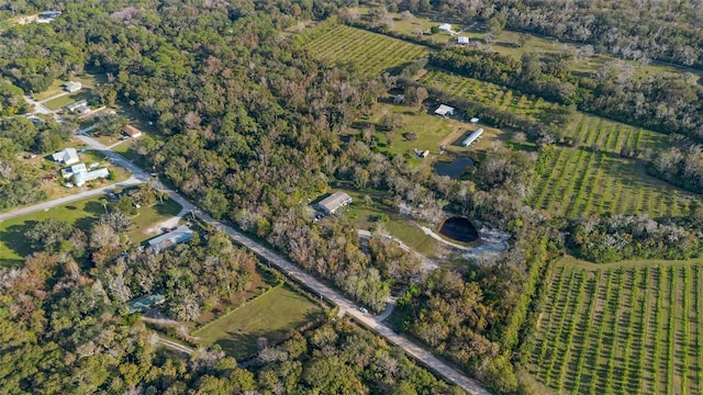 birds eye view of property with a rural view