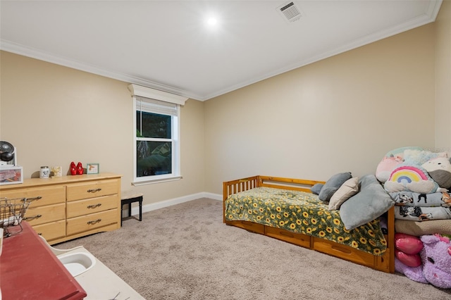 carpeted bedroom with baseboards, visible vents, and ornamental molding