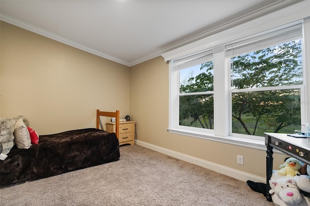 carpeted bedroom with baseboards and crown molding