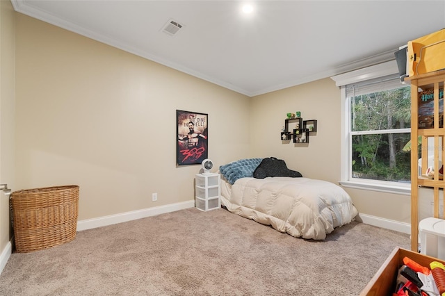 bedroom with baseboards, carpet flooring, ornamental molding, and visible vents
