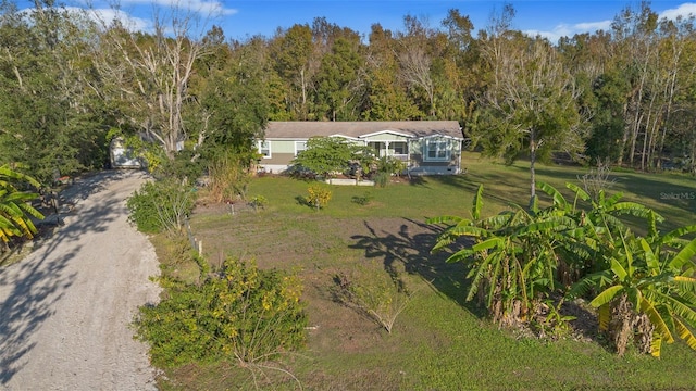 birds eye view of property with a forest view
