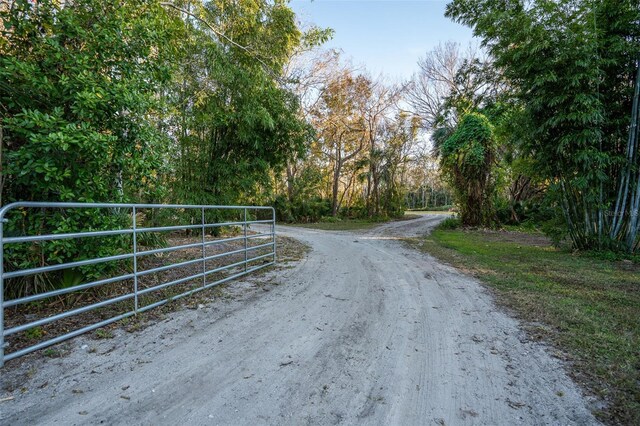 view of road featuring a gate