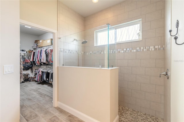 bathroom with a tile shower