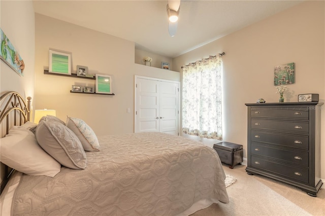 bedroom with light carpet, a closet, and ceiling fan