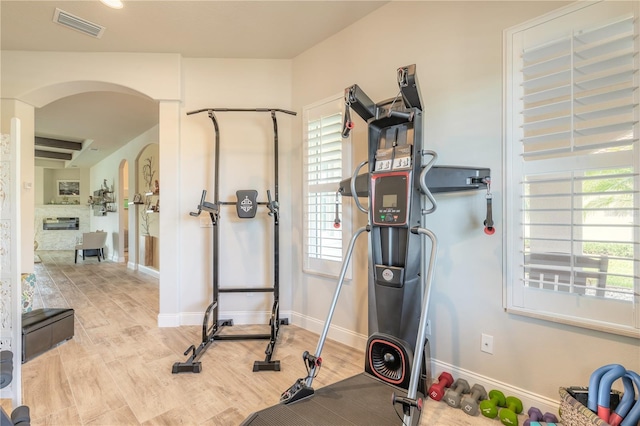 exercise area featuring light wood-type flooring