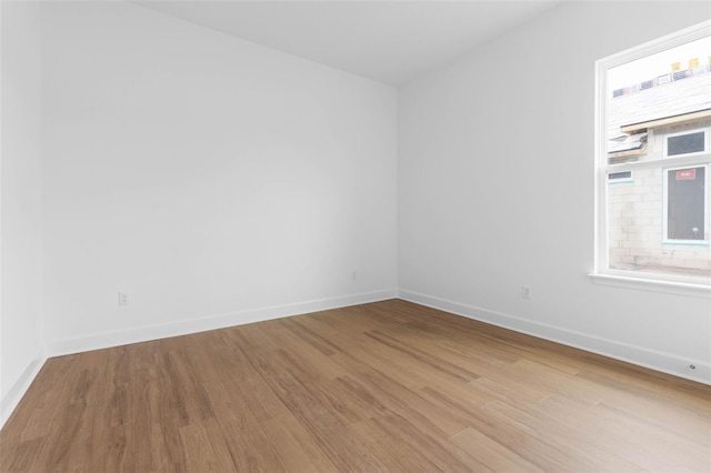 spare room featuring light wood-type flooring