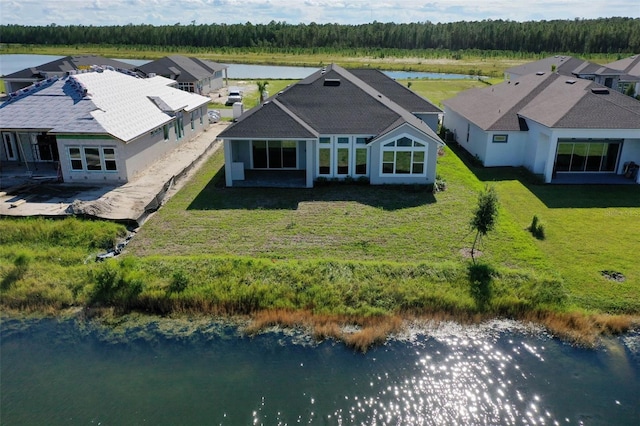 drone / aerial view featuring a water view