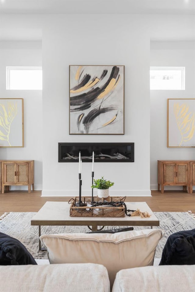 living room featuring light hardwood / wood-style flooring and plenty of natural light