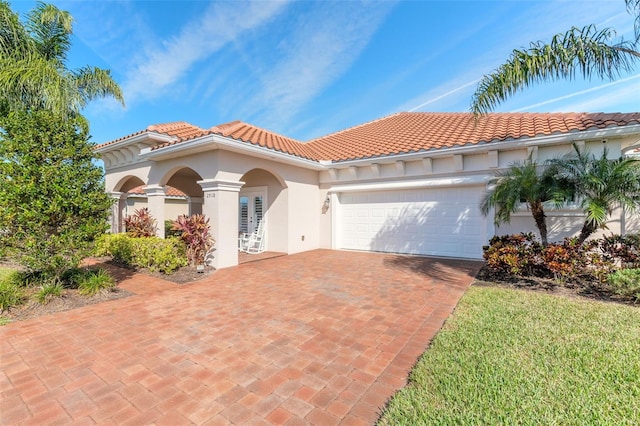 mediterranean / spanish-style house featuring a garage