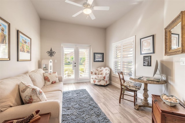 office area with ceiling fan, french doors, and light wood-type flooring