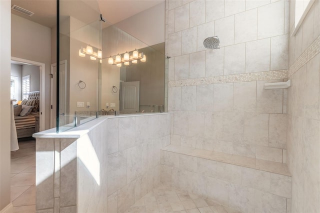 bathroom with a tile shower