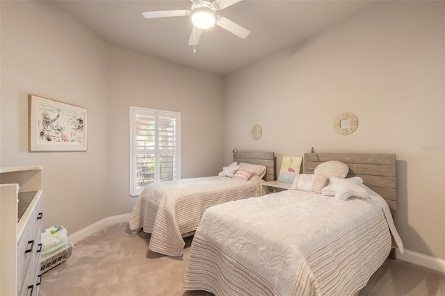 bedroom with light carpet, ceiling fan, and lofted ceiling