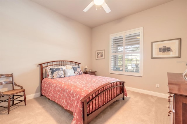 bedroom featuring ceiling fan and light colored carpet