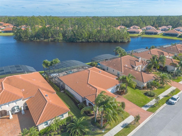 birds eye view of property with a water view