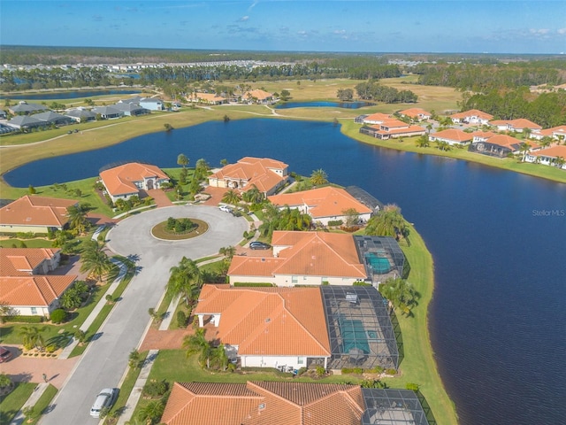 drone / aerial view with a water view