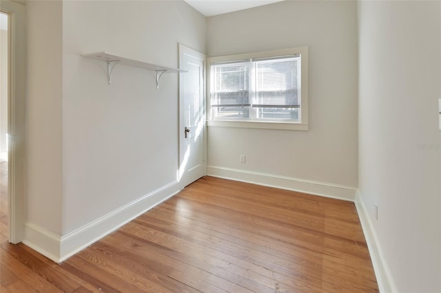 unfurnished room with light wood-type flooring