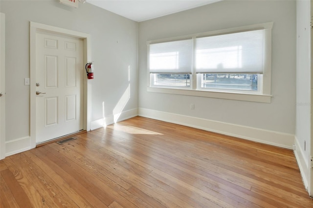 spare room featuring light hardwood / wood-style flooring