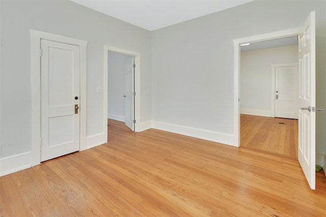 unfurnished room with light hardwood / wood-style flooring