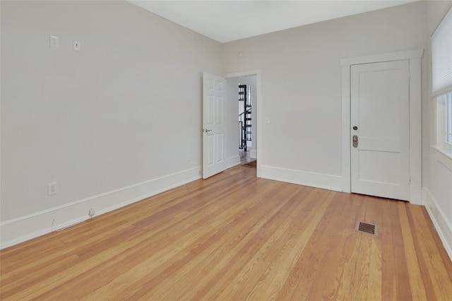 unfurnished room featuring light hardwood / wood-style floors