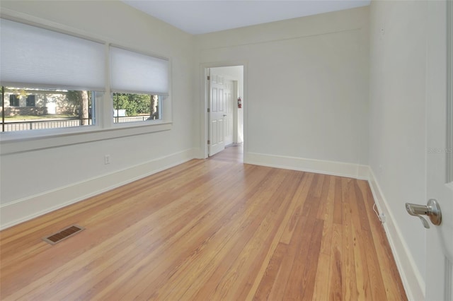 unfurnished room featuring light wood-type flooring