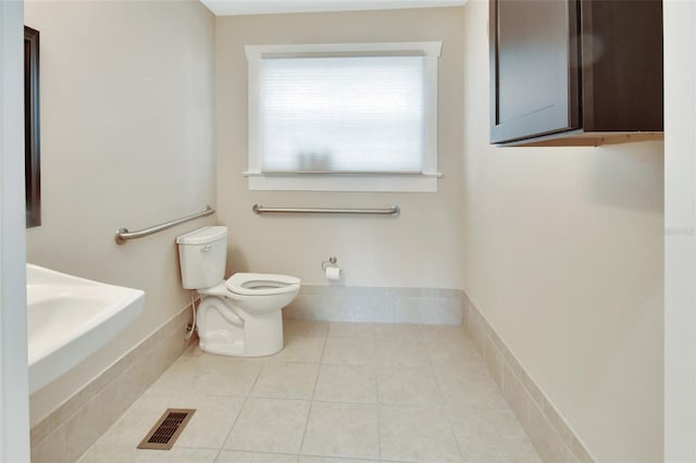 bathroom featuring tile patterned floors and toilet