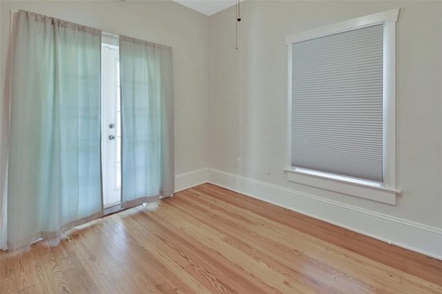 unfurnished room featuring light hardwood / wood-style floors