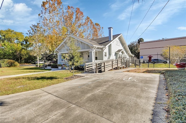 view of property exterior featuring a lawn