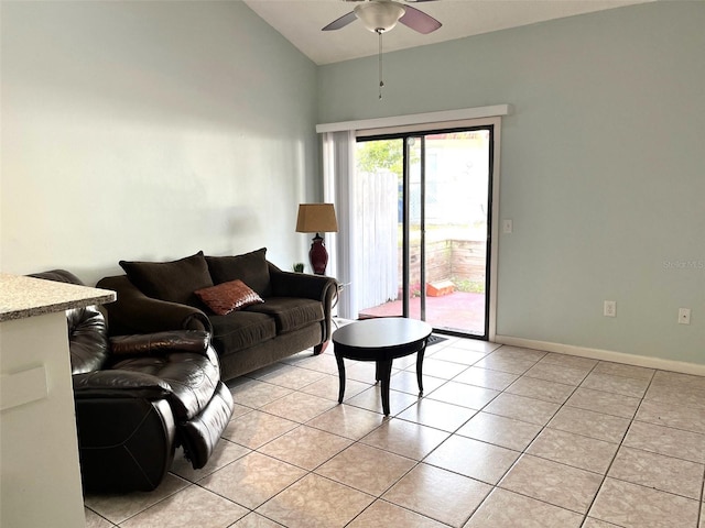 living room with ceiling fan, light tile patterned floors, and vaulted ceiling