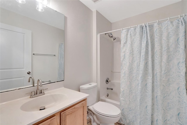 full bathroom with vanity, toilet, and shower / bath combo