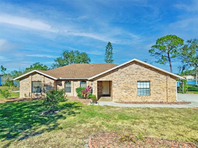 ranch-style home with a front lawn