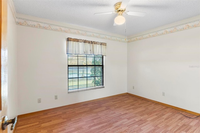 unfurnished room with wood-type flooring, a textured ceiling, and ceiling fan