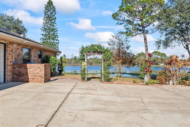 view of patio with a water view