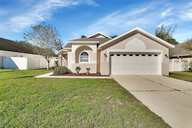 view of front of home featuring a garage and a front lawn