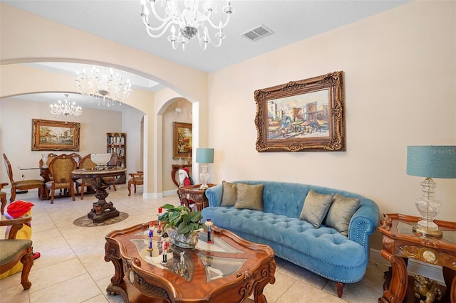 living room with light tile patterned floors and a chandelier