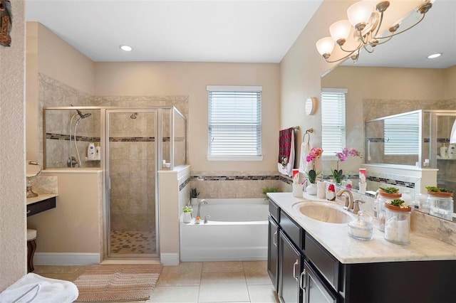 bathroom with vanity, tile patterned flooring, plus walk in shower, and an inviting chandelier