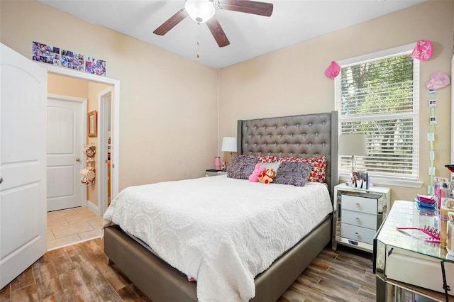 bedroom with hardwood / wood-style floors and ceiling fan