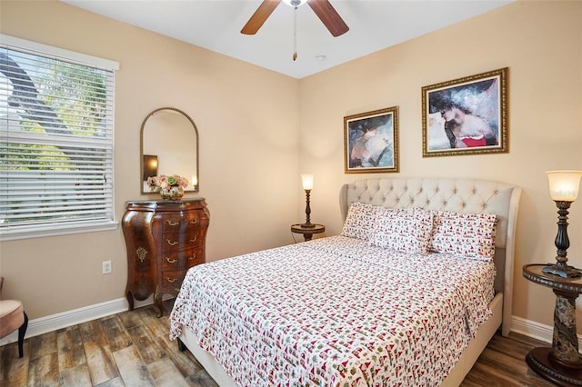 bedroom with dark hardwood / wood-style floors and ceiling fan