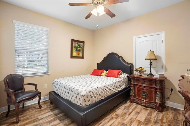 bedroom featuring ceiling fan and light hardwood / wood-style flooring