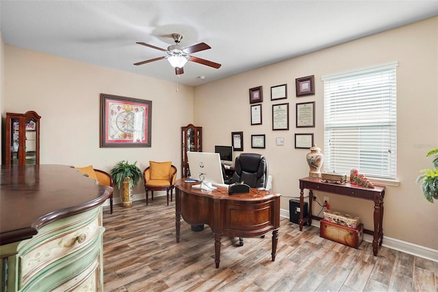 office space with wood-type flooring and ceiling fan