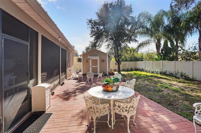 view of patio with a storage unit