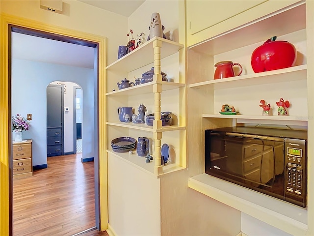 hall featuring hardwood / wood-style flooring