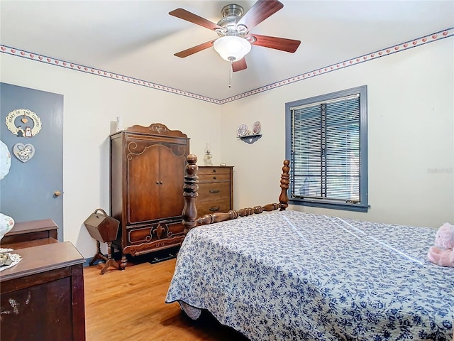 bedroom featuring ceiling fan and light hardwood / wood-style floors