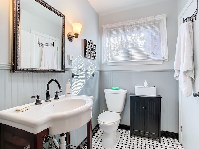 bathroom featuring sink and toilet