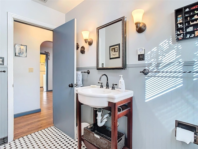 bathroom with hardwood / wood-style flooring