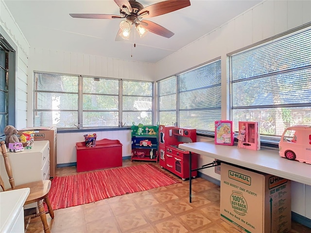 sunroom / solarium with ceiling fan and a wealth of natural light