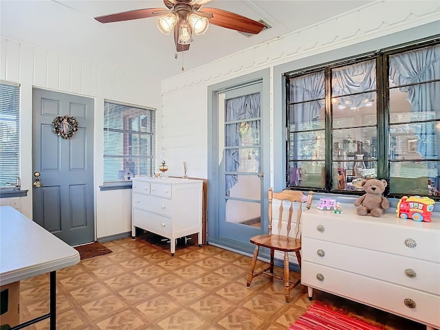 interior space featuring light parquet floors and ceiling fan