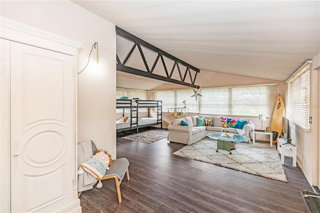 living room with dark hardwood / wood-style flooring and lofted ceiling